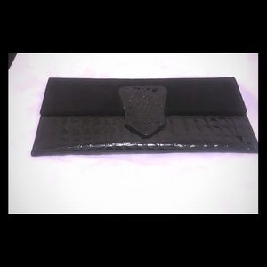 Patent leather and suede clutch by bebe